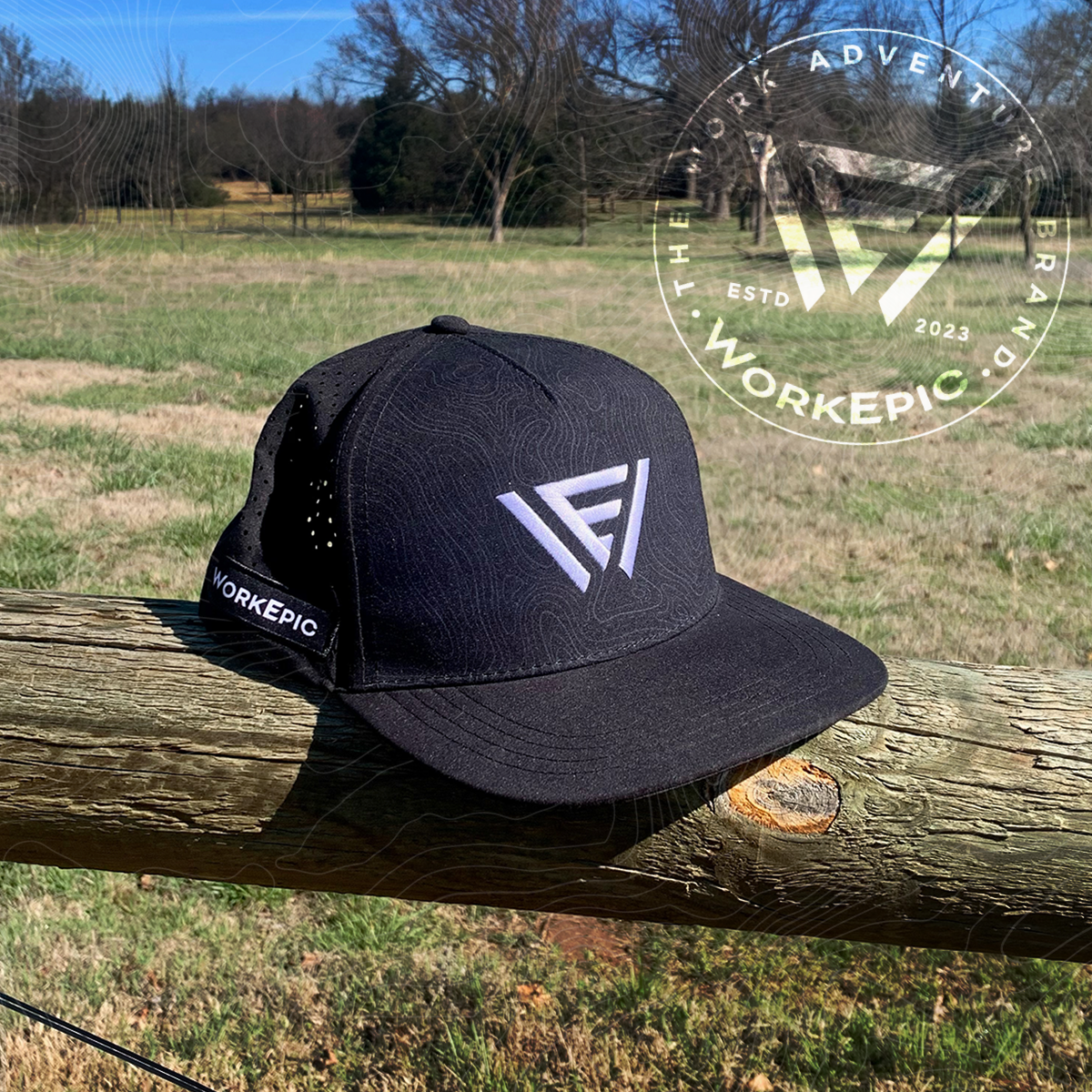 A black hat with a Work Epic logo sitting on a fence