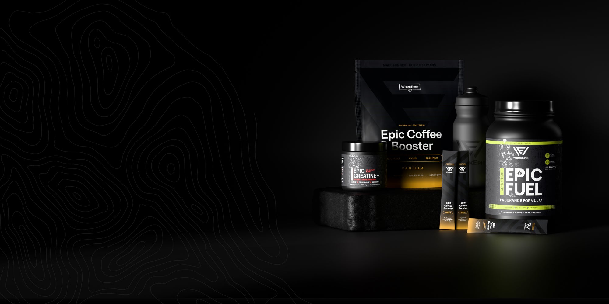 A lineup of black supplement products on a dark studio background, including a large tub labeled Epic Fuel, a bag labeled Epic Coffee Booster, and smaller containers with yellow and white accents.