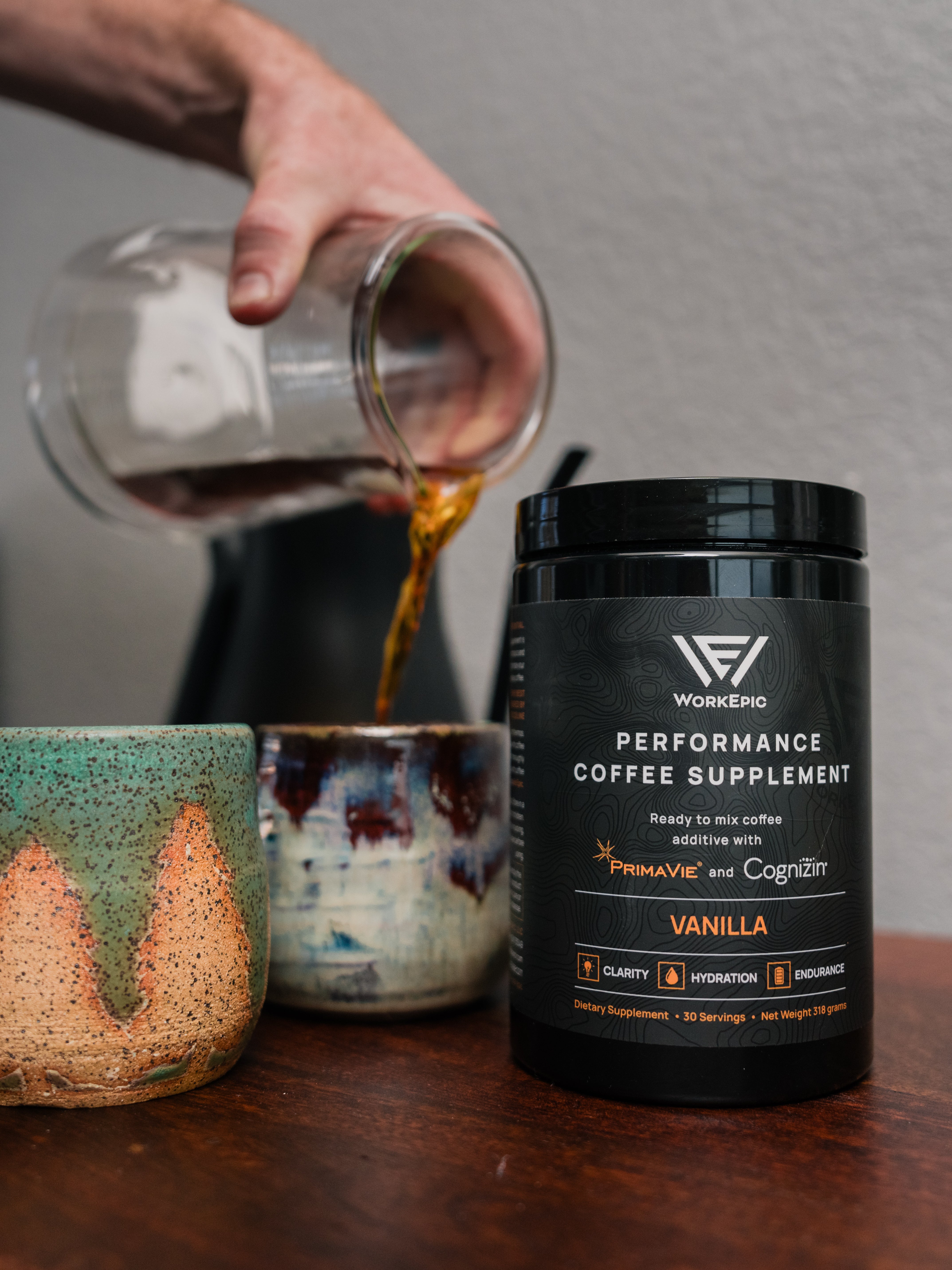 A promotional image of Performance Coffee Supplement on a wooden surface